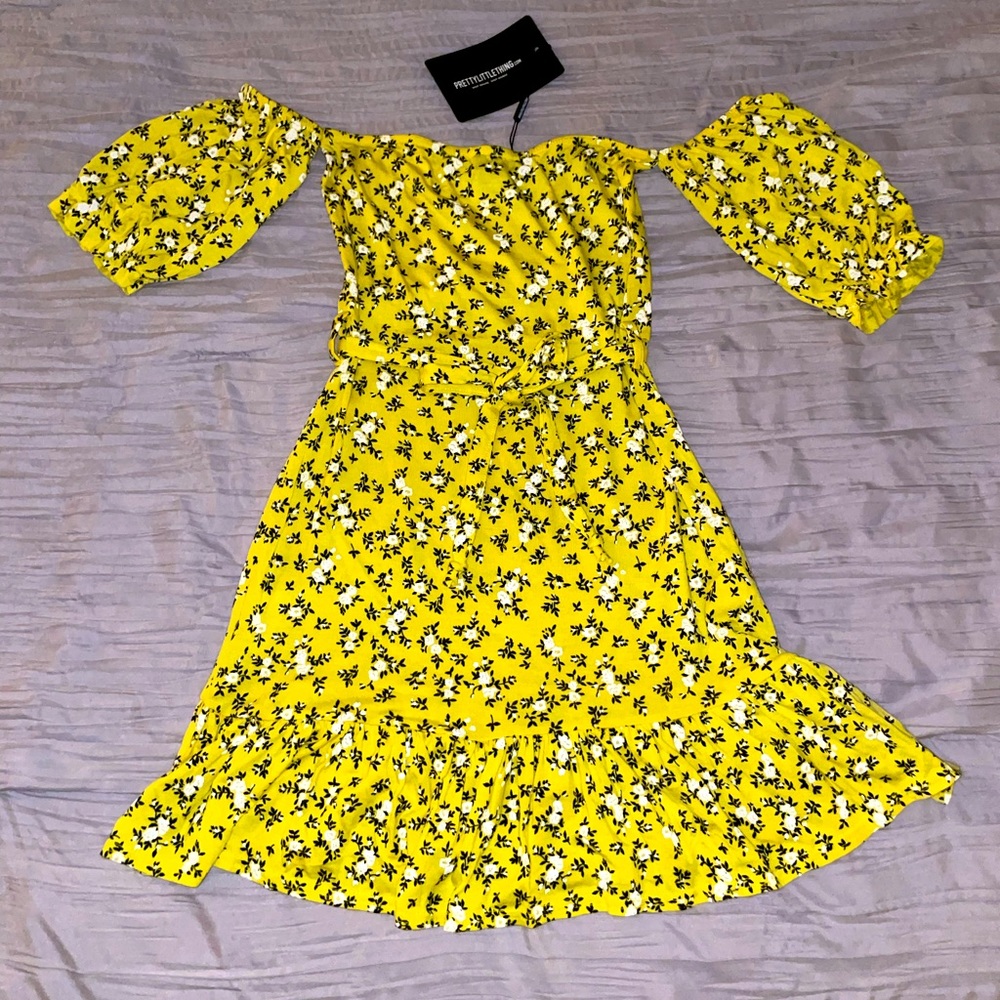 PrettyLittleThings yellow (flowered) off the shoulder dress